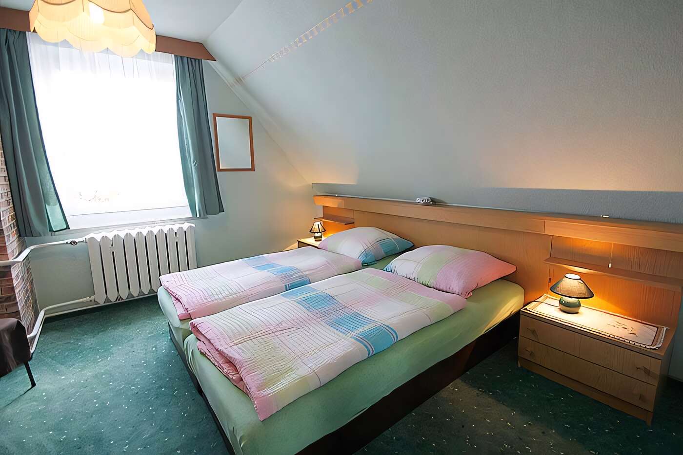 Schlafzimmer 1 der Ferienwohnung mit Doppelbett
